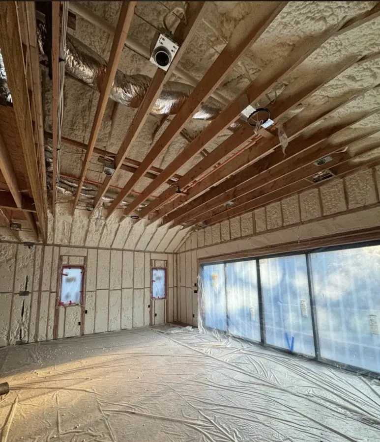 Interior walls and ceiling insulated with spray foam during new construction in Pittsboro